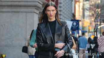 Karlie Kloss turns the streets of New York City into her personal runway as she shows off her toned legs leather look