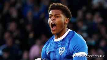 Portsmouth seal promotion with late win over Barnsley