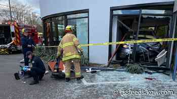 1 person hospitalized after car crashes into Beaverton car dealership