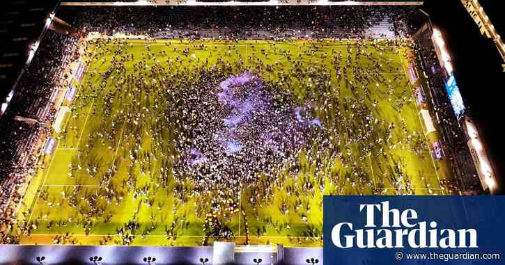 Mesmerising drone footage shows Portsmouth fans filling pitch after winning League One – video
