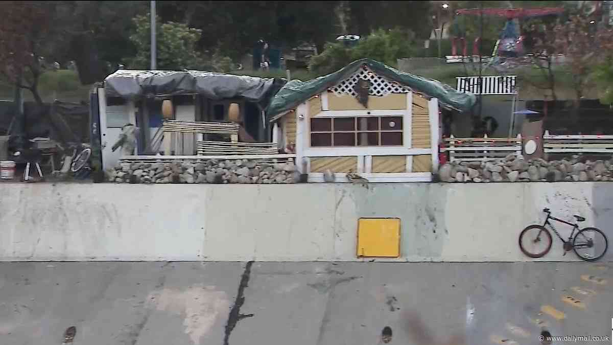 Los Angeles homeless build ramshackle house on side of busy freeway as Democrat mayor asks city's rich and famous to help with crisis by offering affordable long-term housing instead of cracking down on the clean-up