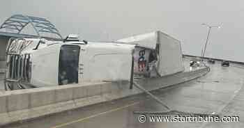 High winds flipped a FedEx truck traveling on Bong Bridge in Duluth