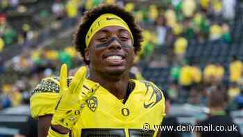 University of Oregon football player, 19, is arrested for fatal hit and run after 46-year-old man was found in the road - as cops reveal eerie clues including the victim's neck being sliced and a hammer at the scene