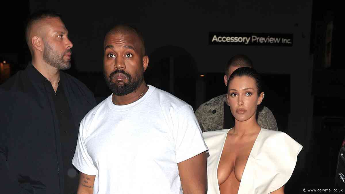 Kanye West is named as battery suspect in police report for 'punching man in the face who grabbed his wife Bianca' - after pair were spotted out at Disneyland