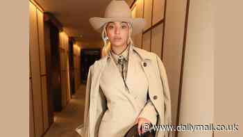 Beyonce stuns in cream-colored suit trench coat and cowboy hat as she heads out for a night on the town with husband Jay-Z