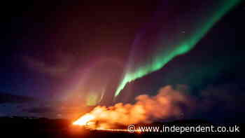 Northern Lights shine over Iceland’s erupting volcano in stunning timelapse footage