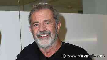 Mel Gibson wears his arm in a sling as he makes an appearance at Unsung Hero movie screening in California