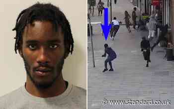 Terrifying moment gunman shoots at rival gang members as shoppers run for cover in Tottenham