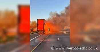 Dramatic photos show lorry engulfed by flames on M56