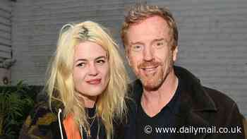 Damian Lewis looks more than loved-up with girlfriend Alison Mosshart as they attend Bella Freud's birthday bash