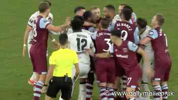 West Ham assistant Billy McKinlay is SENT OFF after furious touchline row with Bayer Leverkusen staff... sparking a mass brawl among the players in chaotic Europa League clash