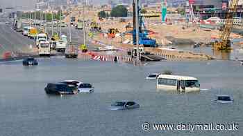 Dubai's sluggish return to 'normality': Planes gradually hit runways again but cars remain stranded in water as the city struggles to get to grips with flooding crisis