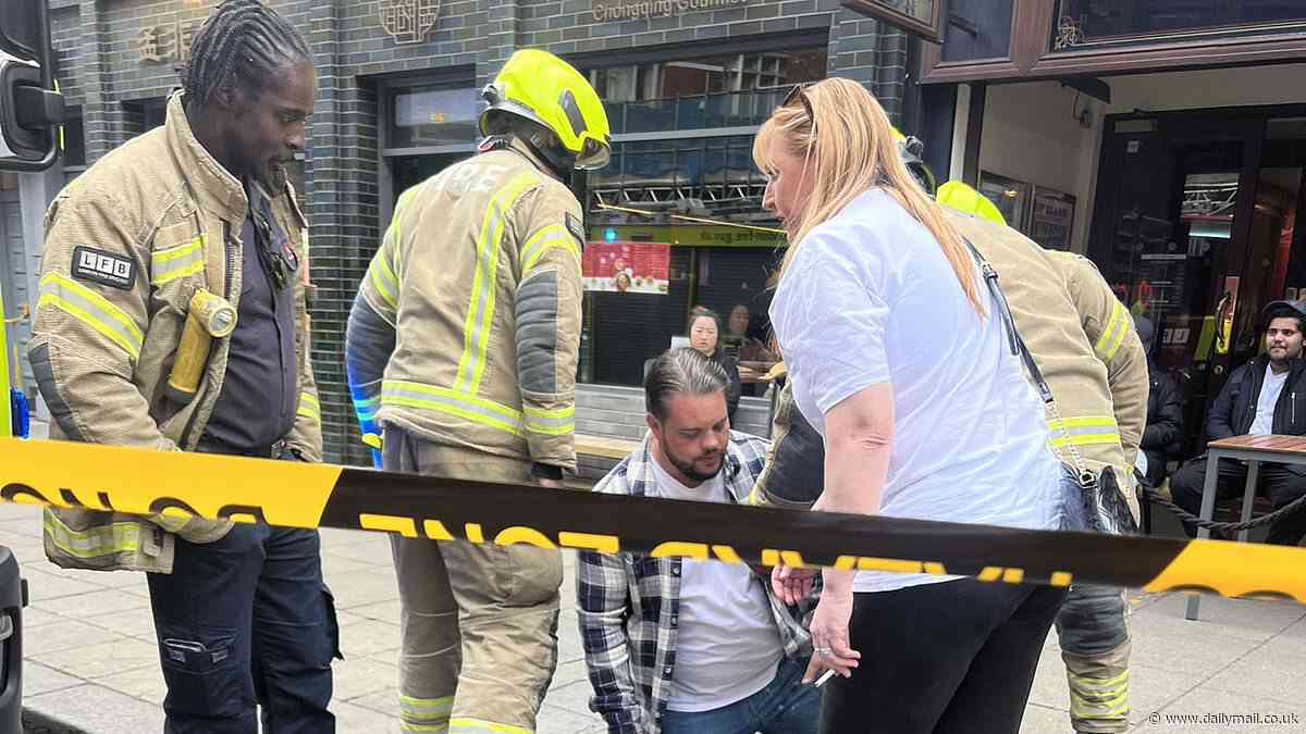 Putting your foot in it! Fire crews come to punter's rescue after he got his leg trapped down a drain outside Wetherspoon pub