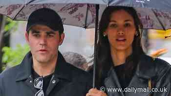 Paul Wesley, 41, shares umbrella with model girlfriend Natalie Kuckenburg, 23, as couple enjoy rainy NYC stroll - after finalizing Ines de Ramon divorce
