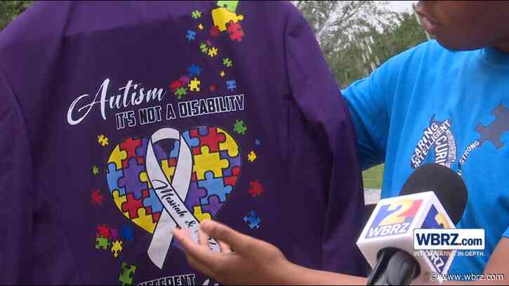 Assumption High senior touches hearts with custom autism acceptance prom suit