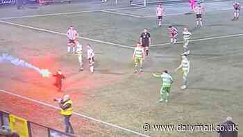 Play is halted after a child carrying a FLARE runs across the pitch during a League of Ireland clash between Derry City and Shamrock Rovers