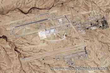 Satellite image analyzed by AP shows damage after Iranian attack on Israeli desert air base