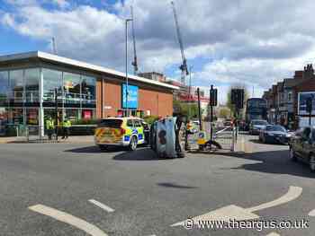 Sussex Police close Hove road after car overturns