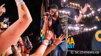 Country singer Luke Bryan slips and falls on stage in Vancouver