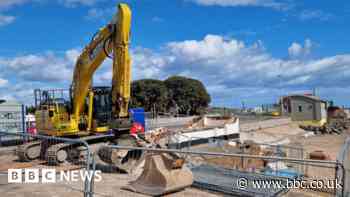 Building demolished as sea wall work continues