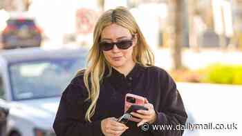 Hilary Duff shows off her growing baby bump in a sleeveless black dress as she steps out in LA... after revealing questions she will NOT be answering