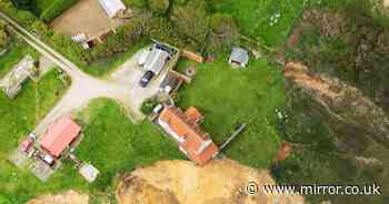 Dramatic new photos show farmhouse hanging over perilous cliff edge due to erosion