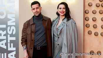 Hayley Atwell looks typically stylish in a grey suit as she poses with fiancé Ned Wolfgang Kelly at TOD's event in Venice after sparking pregnancy rumours
