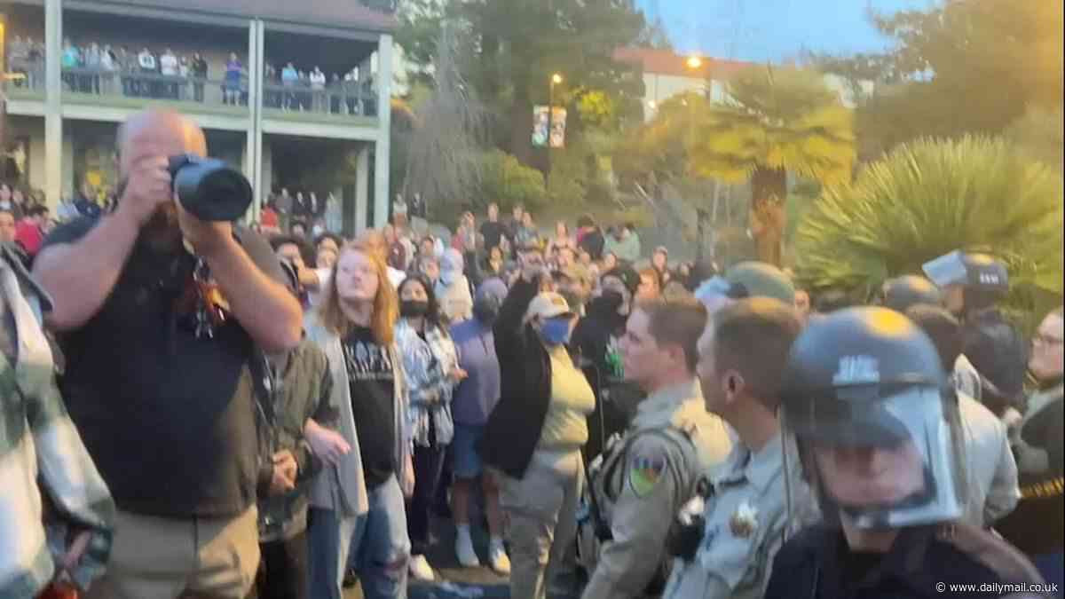 Moment riot cops clash with pro-Palestine protestors after they take over California State Polytechnic University and barricade the entrance as anti-Israel campus chaos spreads