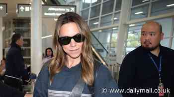 Spice Girl Mel C signs autographs as she quietly slips into Adelaide Airport ahead of her Australian DJ tour