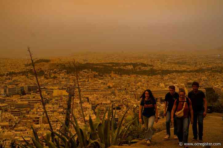 Athens skies turn orange as dust clouds engulf the Greek capital