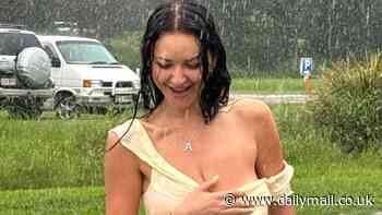 Anna Paul suffers a wardrobe malfunction as her yellow top and skirt turn see-through from the rain