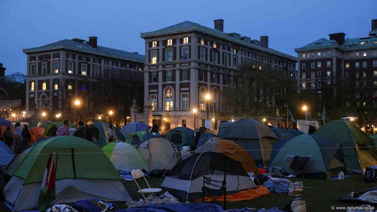 Anti-Israel protesters vow to fight and defend Columbia University encampment as counterterrorism police gather on campus after mob ignored president's midnight deadline to leave