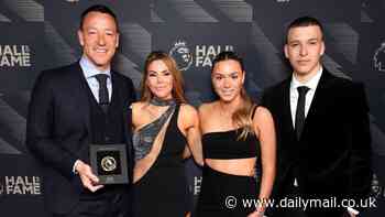 Chelsea legend John Terry poses next to lookalike twins Georgie and Summer, 17, and his wife Toni... as ex-defender celebrates 'special' evening being inducted into the Premier League Hall of Fame with his family
