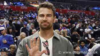 License to spill! James Bond candidate Theo James guzzles beer from a plastic cup during LA basketball game - after ruling himself out of playing the Martini-loving secret agent