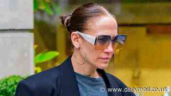 Jennifer Lopez, 54, steps out with no makeup on and wet hair as she flashes her tummy in a crop top in NYC... after trailer for her film Atlas debuts