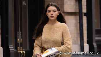 Suri Cruise steps out in stylish sweater and flowing skirt in NYC - after her estranged father Tom Cruise missed her 18th birthday and partied with Posh Spice