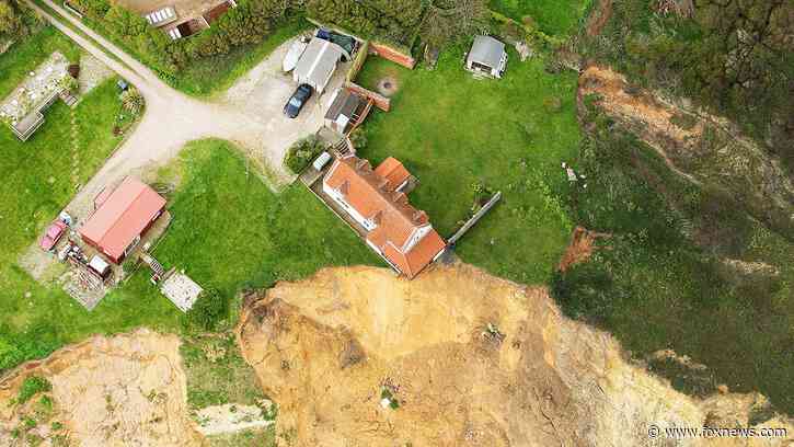 Shocking photos show 18th century farmhouse hanging dangerously over edge of cliff