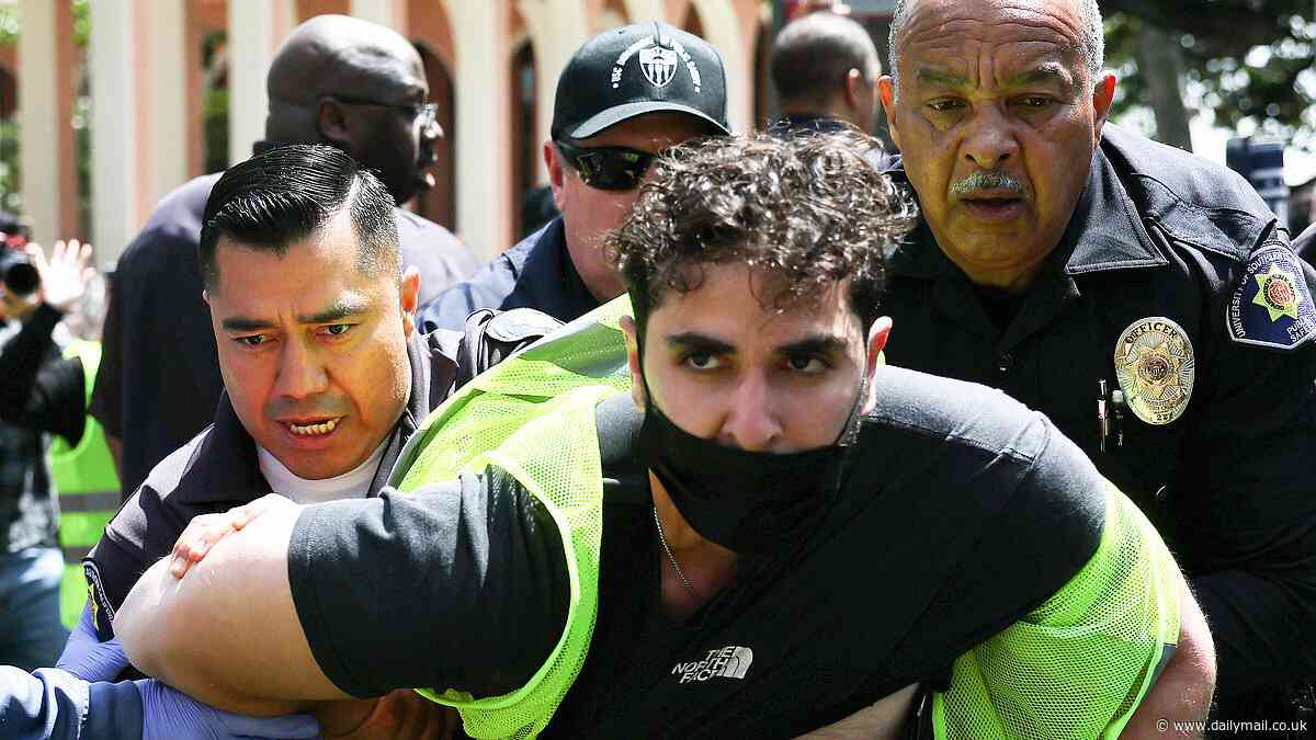 Moment burly California cops detain pro-Palestine protester at USC - only to release him after students surrounded police car and refused to let officers pass