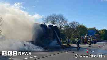 Motorway shut after lorry carrying hay catches fire