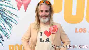 Chris Pine rocks tight denim shorts, a pink corsage and hiking boots as he channels his Poolman character for the premiere of his directorial debut