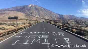 'The Canary Islands have a limit': Latest anti-tourist graffiti appears beneath Tenerife's iconic Teide volcano after official told Brits looking for cheap holidays to go elsewhere
