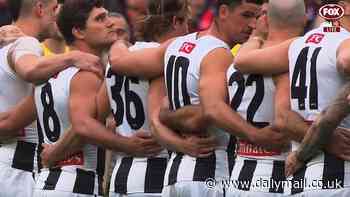 Awkward moment footy star is spotted making X-rated comment during poignant Anzac Day ceremony ahead of Collingwood vs Essendon