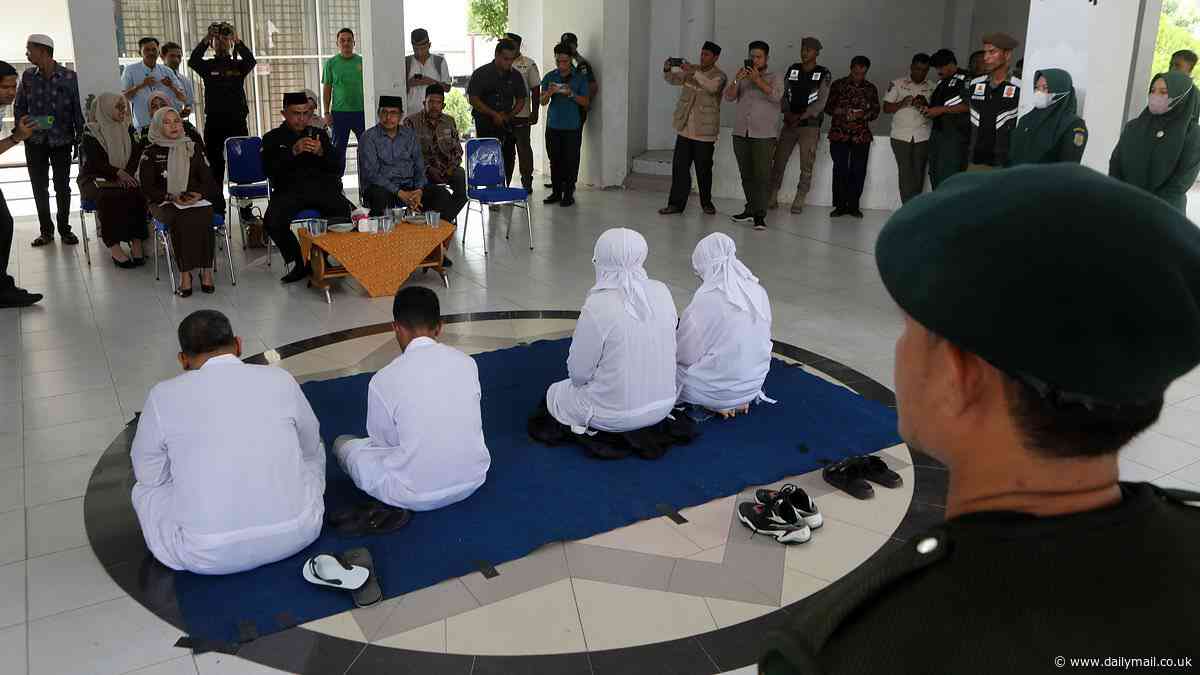 Two couples are thrashed 20 times with canes as punishment for being caught 'having sex outside marriage' in Sharia law-ruled region of Indonesia