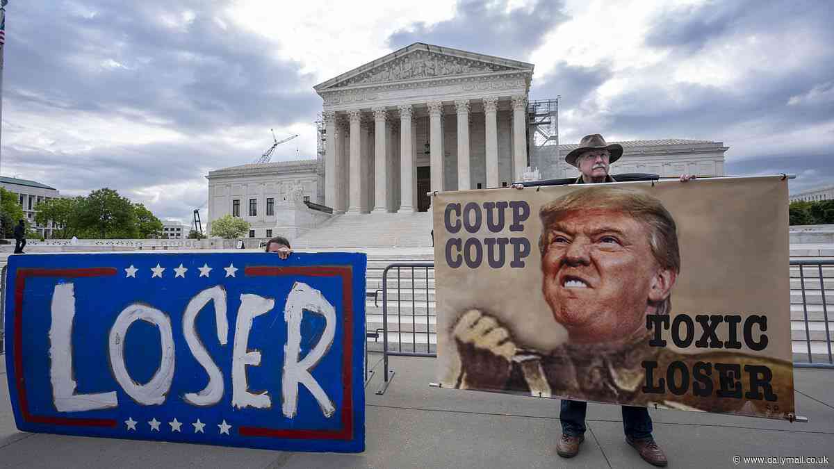 Anti-Trump protesters hold 'LOSER' signs outside the Supreme Court as justices will determine whether Donald has immunity from prosecution