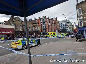 Kilburn High Road: Two people stabbed outside London Overground station as police shut busy road