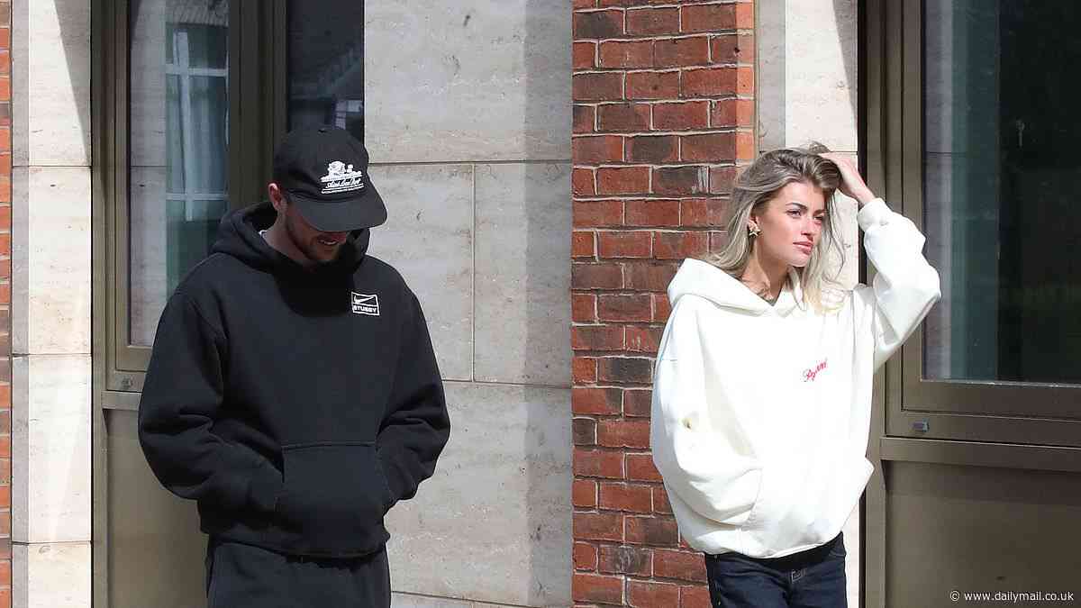 Man United star Mason Mount is spotted walking with a mystery blonde woman in Altrincham... before midfielder finds parking ticket on his £120,000 Land Rover