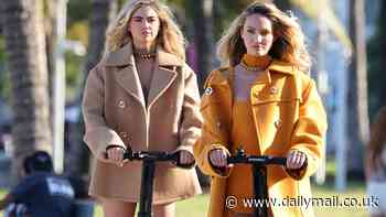 Candice Swanepoel and Kate Upton show off their long legs as they pose up a storm on Segways in high-fashion rompers