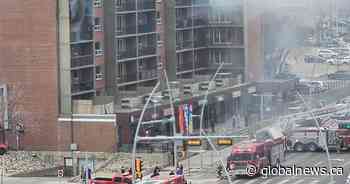 Man rescued from fiery balcony as Edmonton crews battle Jasper Avenue fire
