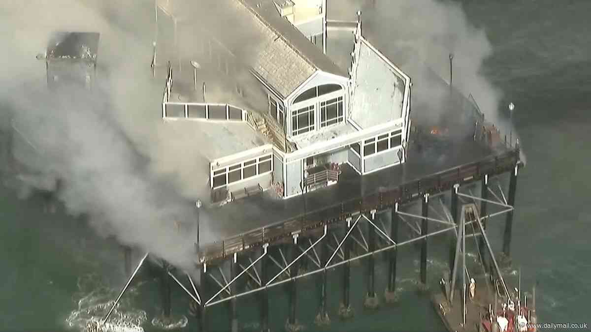Oceanside Pier in San Diego is consumed by huge fire, forcing visitors to evacuate 1954-foot long structure that's longest pier on West Coast