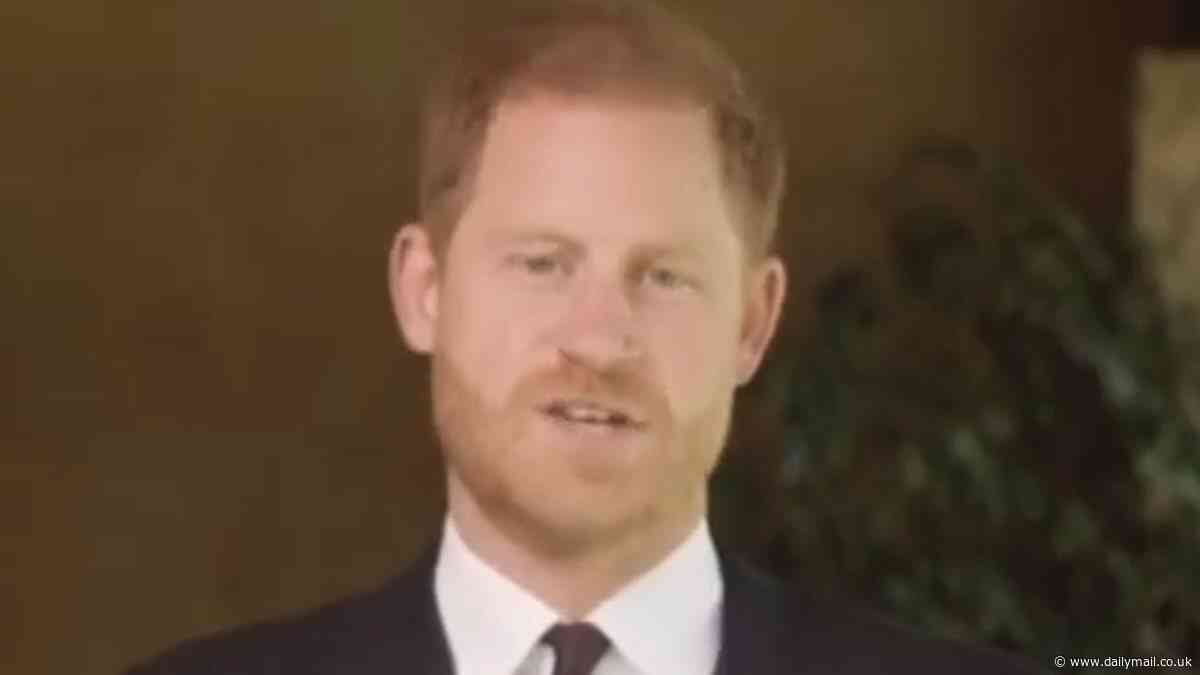 Clean-cut Prince Harry dons his medals for video from the back door of his Montecito mansion to present a soldier of the year award to US combat medic